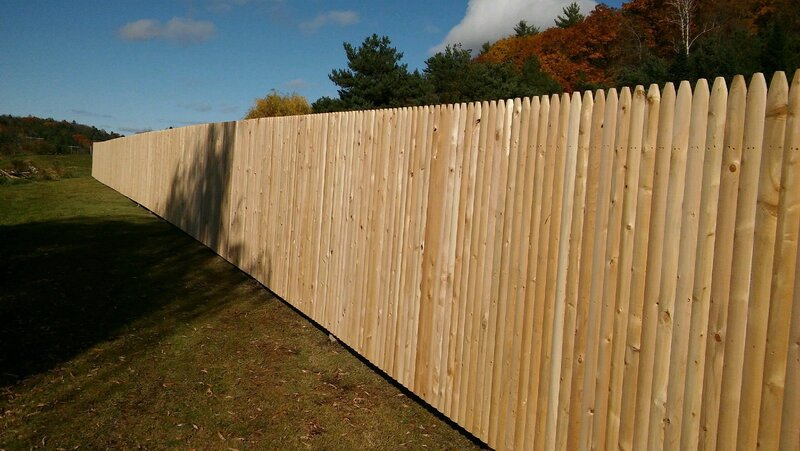 Complete stockade cedar fence around large property