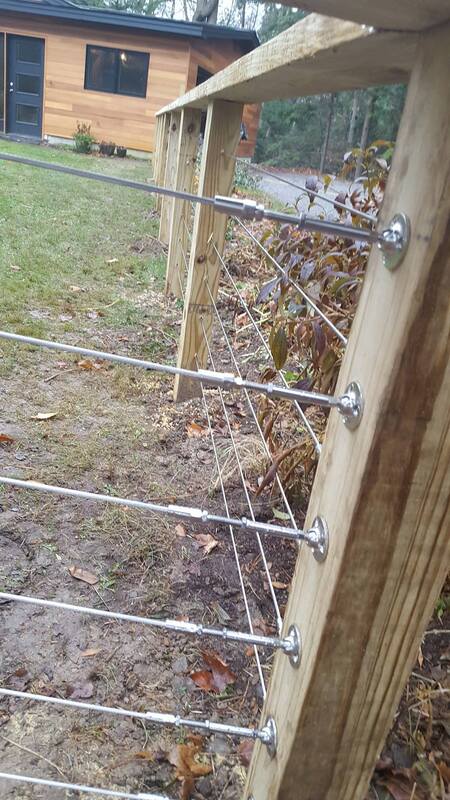 Contemporary horizontal metal fencing with wood posts