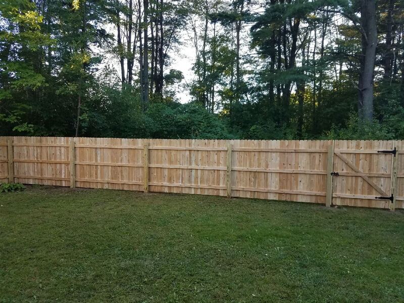Complete stockade cedar fence around large property