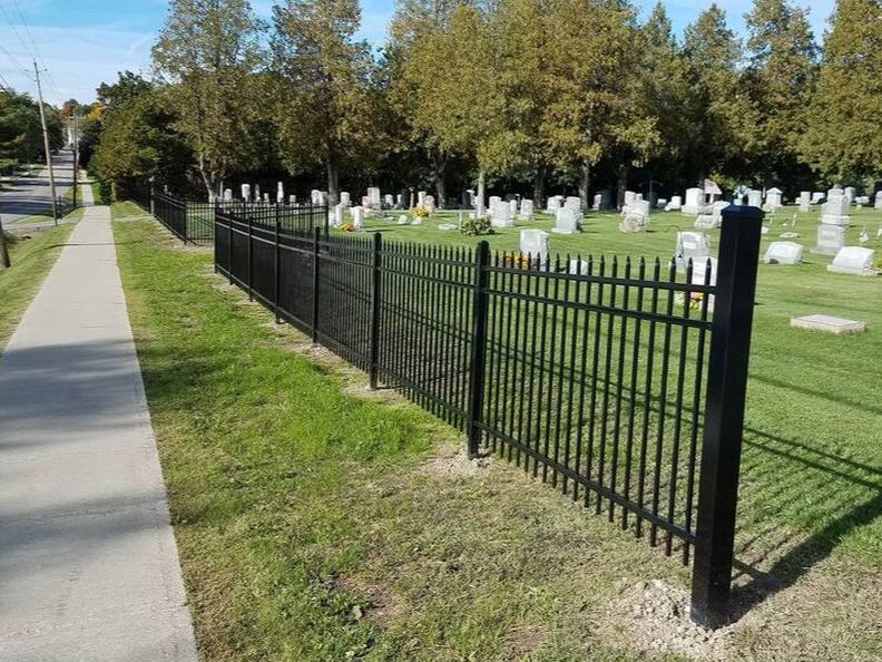 Decorative metal fence around cemetary
